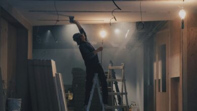 man on white ladder
