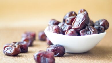 brown round fruit on white ceramic bowl
