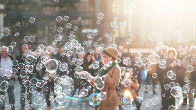 woman standing outdoor surrounded by bobbles during daytime
