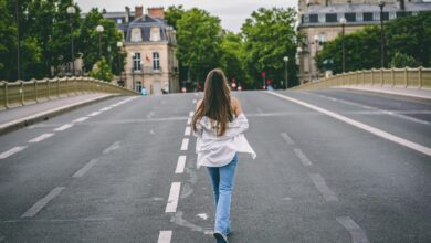 a person walking across a street