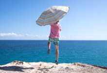 person holding umbrella during daytime