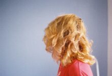 blonde haired woman in red shirt