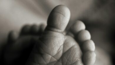selective focus photography of baby foot sole