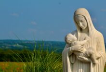 a statue of a person and a baby