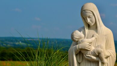 a statue of a person and a baby