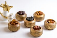 a group of small wooden bowls with brown objects in them
