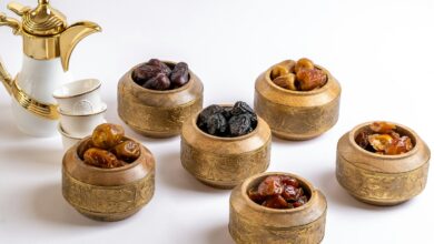 a group of small wooden bowls with brown objects in them