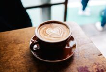 latte art in brown cup in macro photography
