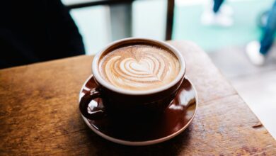 latte art in brown cup in macro photography