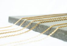 a gold chain with a black band