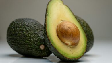 an avocado cut in half on a table
